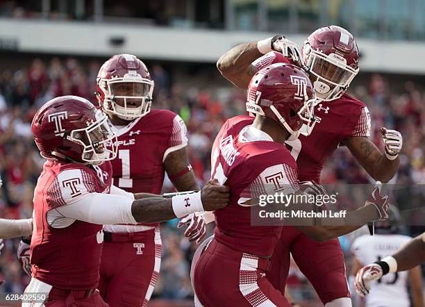 Phillip Walker, Romond Deloatch, Adonis Jennings, and Jahad Thomas of the Temple Owls celebrate against the Cincinnati Bearcats at Lincoln Financial...