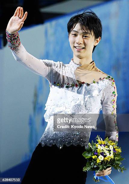 Russia - Yuzuru Hanyu of Japan waves to the audience after winning the men's figure skating competition at the Sochi Winter Olympics in Russia on...