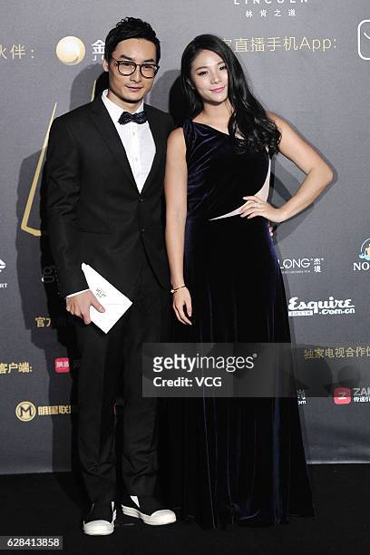 Diving couple Qin Kai and He Zi pose on the red carpet of the 13th Man At His Best Award at the Worker's Stadium on December 7, 2016 in Beijing,...