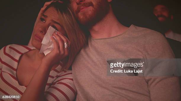 young couple at the cinema watching movie - indian couple in theaters stock pictures, royalty-free photos & images