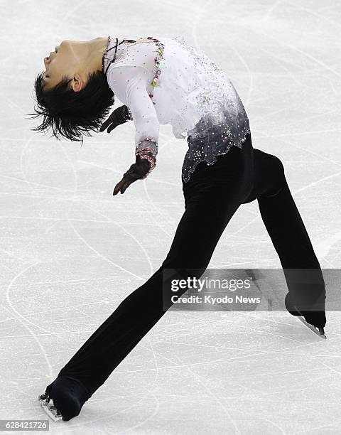 Russia - Yuzuru Hanyu of Japan performs an "Ina Bauer" back bend during his free program in the men's figure skating event at the Winter Olympics in...