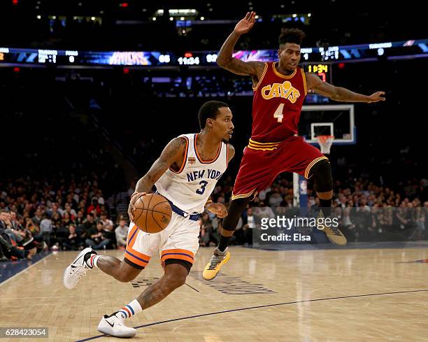Brandon Jennings of the New York Knicks heads for the net as Iman Shumpert of the Cleveland Cavaliers defends at Madison Square Garden on December 7,...