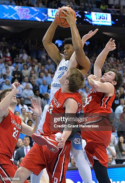 Isaiah Hicks of the North Carolina Tar Heels battles Peyton Aldridge of the Davidson Wildcats for a rebound during the game at the Dean Smith Center...