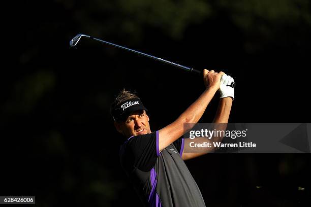 Ian Poulter of England play his second shot into the 15th green during the first round of the UBS Hong Kong Open at The Hong Kong Golf Club on...