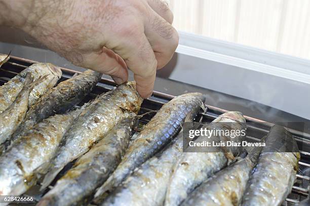 grilling sardines at home - fumes cooking stock pictures, royalty-free photos & images