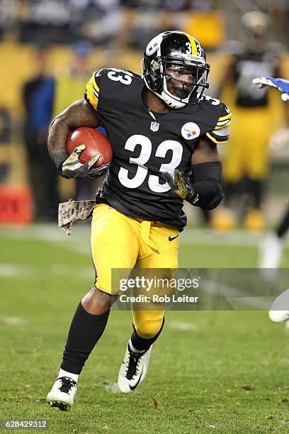 Fitzgerald Toussaint of the Pittsburgh Steelers runs with the ball during the game against the Dallas Cowboys at Heinz Field on November 13, 2016 in...