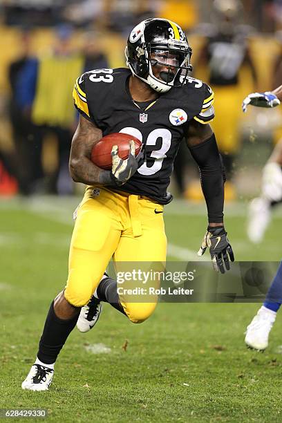 Fitzgerald Toussaint of the Pittsburgh Steelers runs with the ball during the game against the Dallas Cowboys at Heinz Field on November 13, 2016 in...