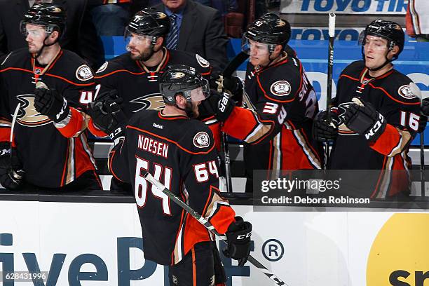 Stefan Noesen of the Anaheim Ducks celebrates his first career goal with Ryan Kesler, Jakob Silfverberg and Ryan Garbutt during the second period of...