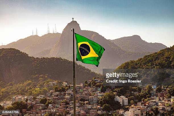 brazilian flag and corcovado - brasiliens flagga bildbanksfoton och bilder