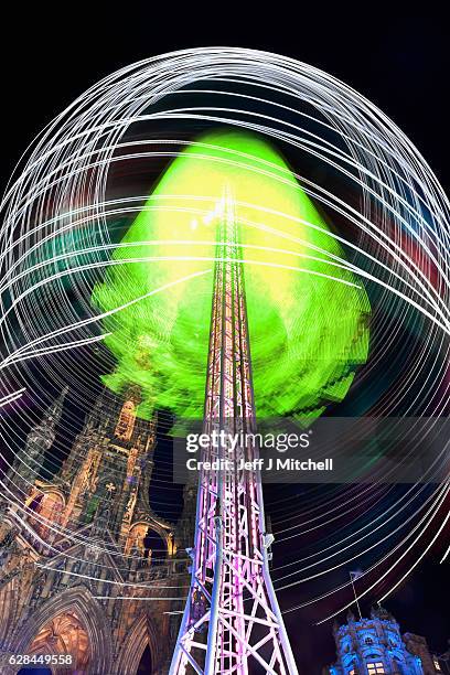 Members of the public enjoy a ride on the Star Flyer on December 7, 2016 in Edinburgh, Scotland. The Christmas Market is situated in Princes Street...