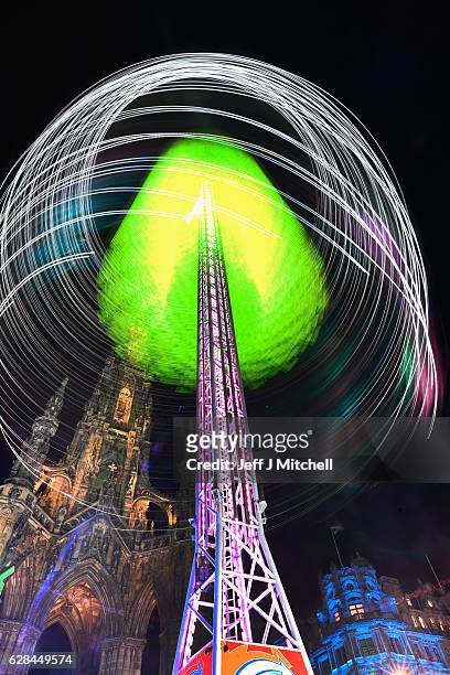 Members of the public enjoy a ride on the Star Flyer on December 7, 2016 in Edinburgh, Scotland. The Christmas Market is situated in Princes Street...