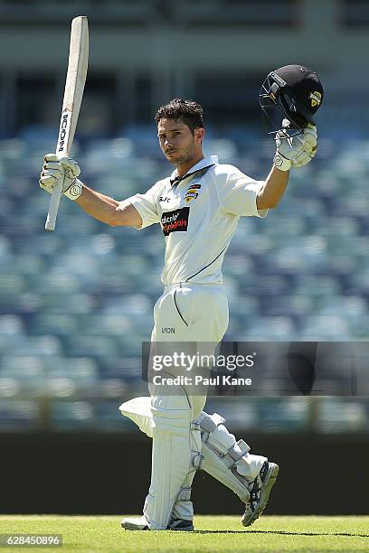 Jonathan Wells of Western Australia celebrates his century during day four of the Sheffield Shield match between Western Australia and Queensland at...