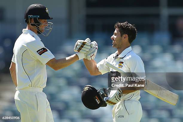 Jonathan Wells of Western Australia celebrates his century with Adam Voges during day four of the Sheffield Shield match between Western Australia...