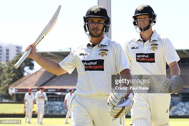 Jonathan Wells and Adam Voges of Western Australia walk from the field after winning the match on day four of the Sheffield Shield match between...