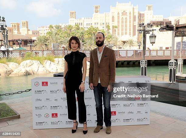 Olga Kurylenko and Ali Suliman attend the IWC Filmmaker Award photocall during day two of the 13th annual Dubai International Film Festival held at...