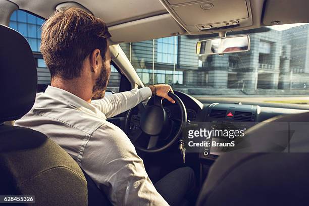businessman going on a business trip by car. - business person driving stockfoto's en -beelden