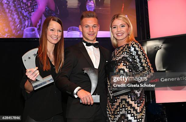 Singer Christina Stuermer,Joshua Kimmich, FC Bayern Muenchen soccer player and Nicole Cross with award during the 10th Audi Generation Award 2016 at...