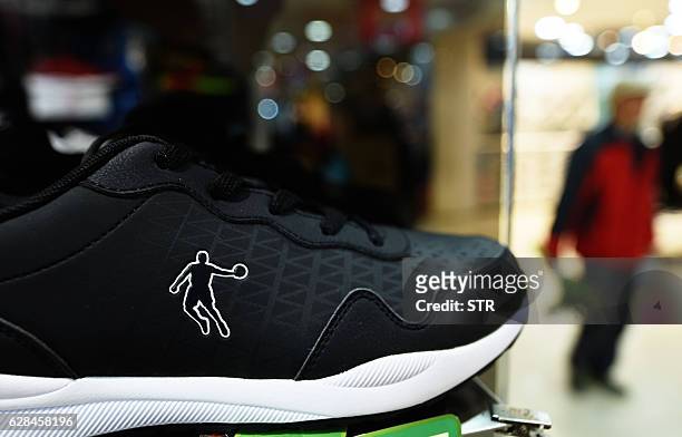 Qiaodan brand shoe is displayed at a Qiaodan store in Hangzhou in China's Zhejiang province on December 8, 2016. Basketball mega-star Michael Jordan...
