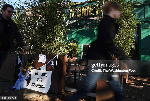 People pass by Comet Ping Pong on Monday Decmmber 05, 2016 in Washington, DC. A man identified as Edgar Maddison Welch was arrested Sunday after...