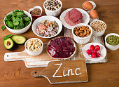 Foods with Zinc mineral on a wooden table.