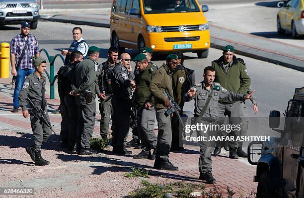 Israeli security forces gather at the site where a Palestinian was shot dead after reportedly attempting to stab Israeli border policemen, on...