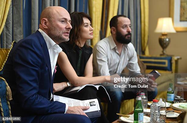 Georges Kern, CEO IWC Schaffhausen, Olga Kurylenko and Ali Suliman attend the jury meeting of the fifth IWC Filmmaker Award at the 13th Dubai...