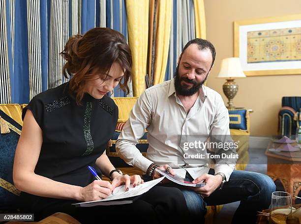 Olga Kurylenko and Ali Suliman attend the jury meeting of the fifth IWC Filmmaker Award at the 13th Dubai International Film Festival , during which...