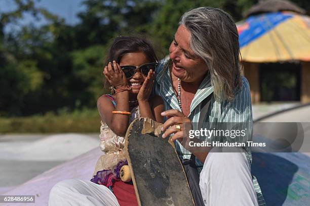 German community activist and author Ulrike Reinhard with village girl at Skating park, popularly known as Janwaar Castle on October 26, 2016 in...