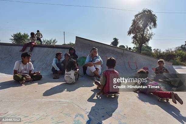 German community activist and author Ulrike Reinhard with village children at Skating park, popularly known as Janwaar Castle on October 26, 2016 in...