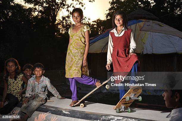 Young girls pose with their skate boards at Skating park, popularly known as Janwaar Castle on October 26, 2016 in Janwaar, India. Thanks to a German...