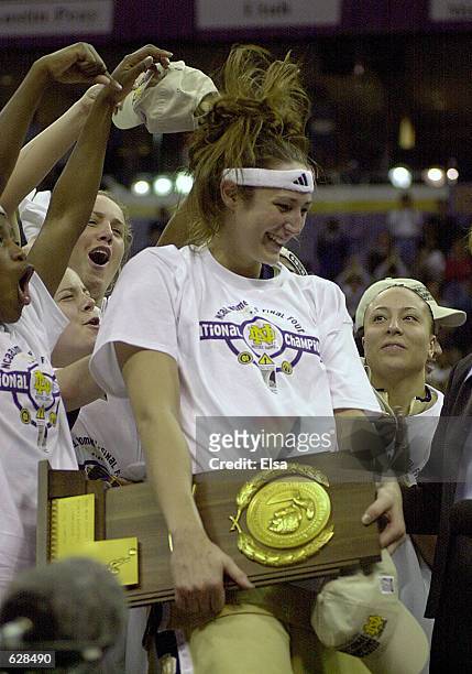 Ruth Riley of Notre Dame celebrates with teammates after Notre Dame beat Purdue 68-66 to win the NCAA Women's Basketball Championship Game at the...