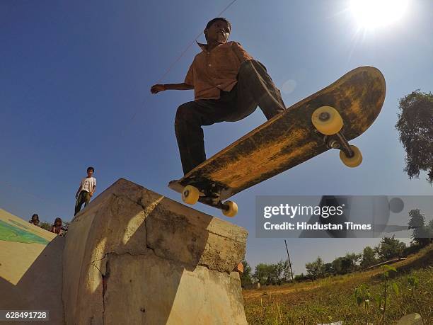 Young boy riding on a skateboard at Skating Park, popularly known as Janwaar Castle, on October 26, 2016 in Janwaar, India. JANWAAR, INDIA German...