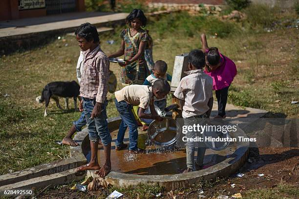 The kids washing their plates after having mid-day meal served in the school on October 26, 2016 in Janwaar, India. Thanks to a German community...