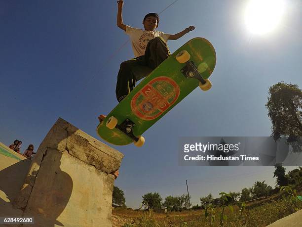 Young boy riding on a skateboard at Skating Park, popularly known as Janwaar Castle, on October 26, 2016 in Janwaar, India. Thanks to a German...
