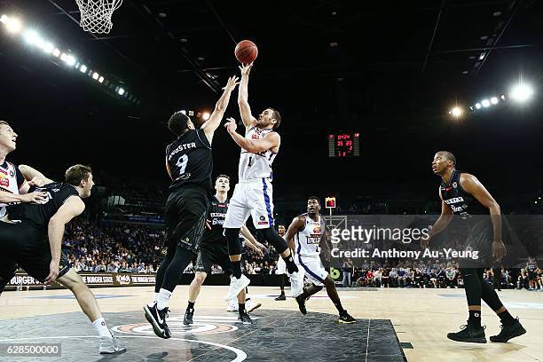 Adam Gibson of the Bullets puts up a shot over Corey Webster of the Breakers during the round 10 NBL match between the New Zealand Breakers and the...