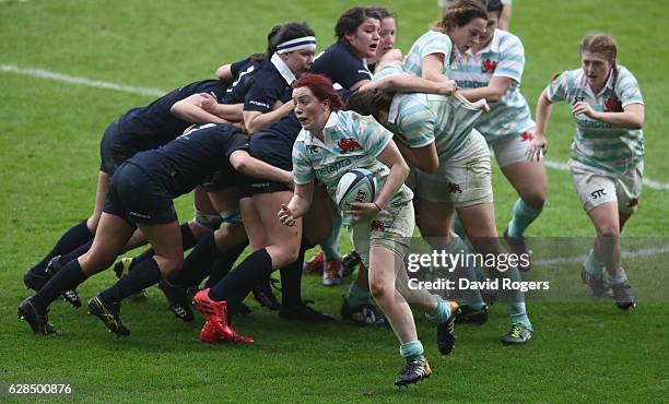 Jessica Charlton of Cambridge breaks with the ball during the Women's Varsity match between Cambridge University and Oxford University at Twickenham...