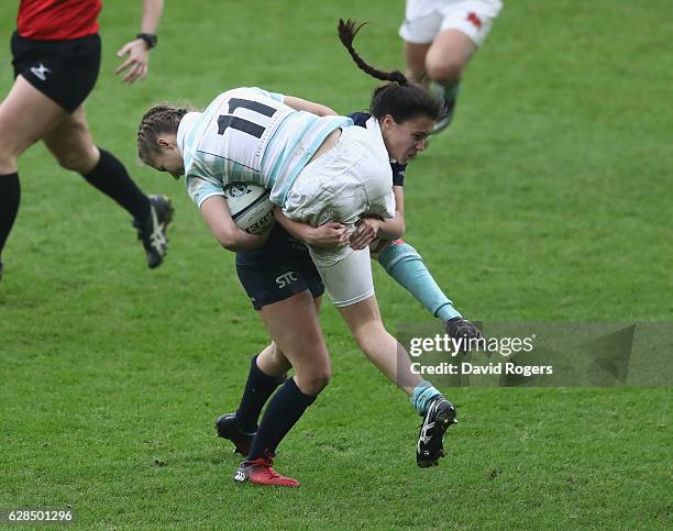 Sophie Trott of Oxford tackles Lara Gibson during the Women's Varsity match between Cambridge University and Oxford University at Twickenham Stadium...