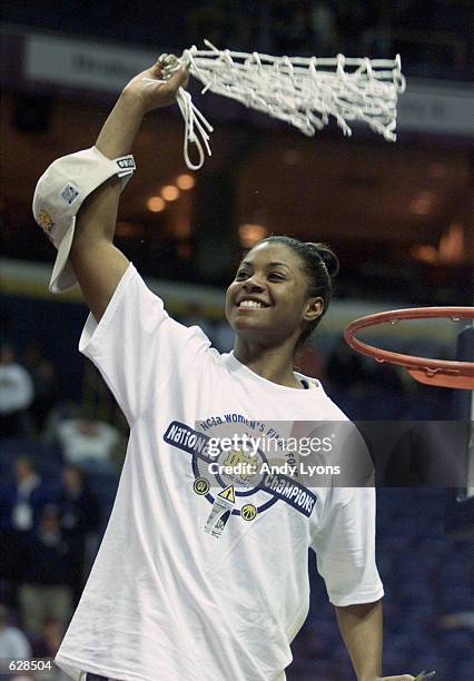 Niele Ivey of Notre Dame swings the net after Notre Dame beat Purdue 68-66 to win the NCAA Women's Basketball Championship Game at the Savvis Center...