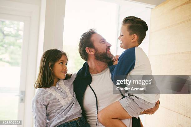 happy to be together again! - family smiling at front door stock pictures, royalty-free photos & images