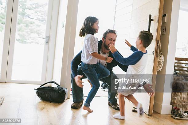 we missed you! - family smiling at front door stock pictures, royalty-free photos & images