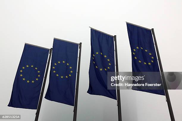 European Union flags hang in the fog at the ECB building on December 8, 2016 in Frankfurt, Germany. The ECB today announced that it would continue...