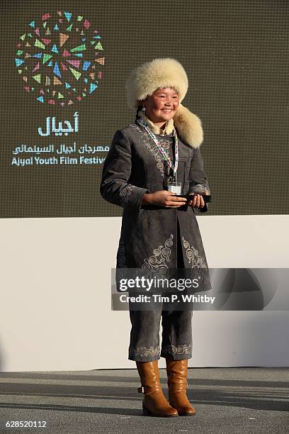 Aisholpan Nurgaiv poses at the award ceremony during the Ajyal Youth Film Festival on December 5, 2016 in Doha, Qatar.