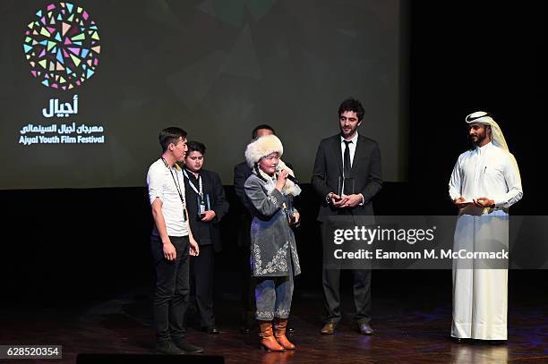 Aisholpan Nurgaiv speaks on stage of the closing ceremony and screening of 'The Red Turtle' during the Ajyal Youth Film Festival on December 5, 2016...