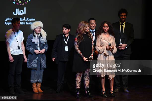 Aisholpan Nurgaiv , Julian Dennison, Faiza Ambah, Shingo Usami, Oulaya Amamra and Steven Wouterlood are seen on stage of the closing ceremony and...