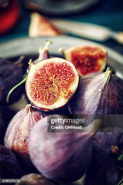 figs and sweet honey on wooden background - fig stock pictures, royalty-free photos & images