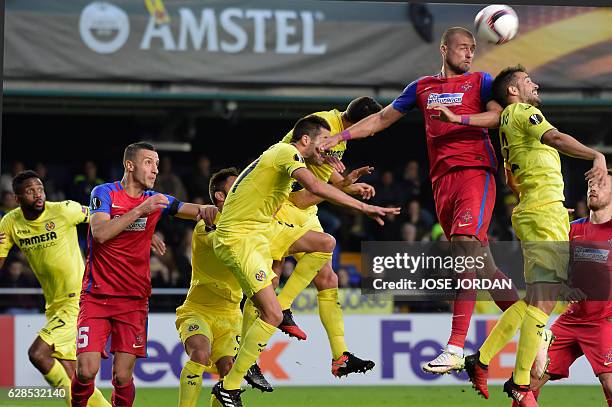 Steaua's defender Gabriel Tamas vies with Villarreal's defender Mario during the UEFA Europa League football match Villarreal CF vs FC Steaua...