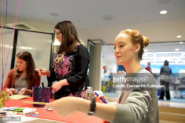 Fiddler On The Roof cast members Sarah Oakes Muirhead, Mindy Cimini, and Victoria Britt decorate picture frames at Boston Children's Hospital on...