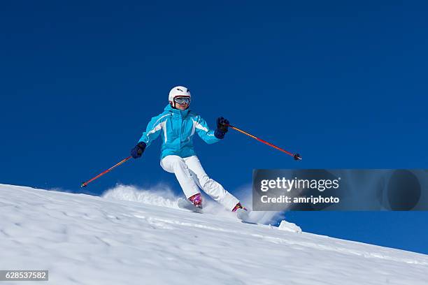 skiing woman on skis in powder snow - austria ski stock pictures, royalty-free photos & images