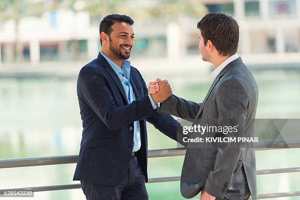 business deal in middle east - dubai jbr stock pictures, royalty-free photos & images