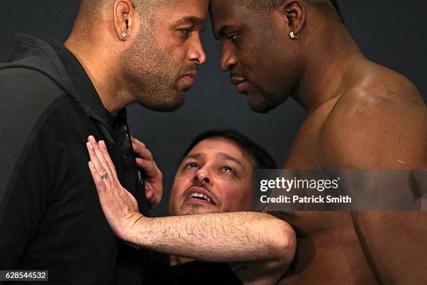 Vice President of Talent Relations, Joe Silva, gets between opponents Anthony Hamilton and Francis Ngannou during a face off at the UFC Fight Night...